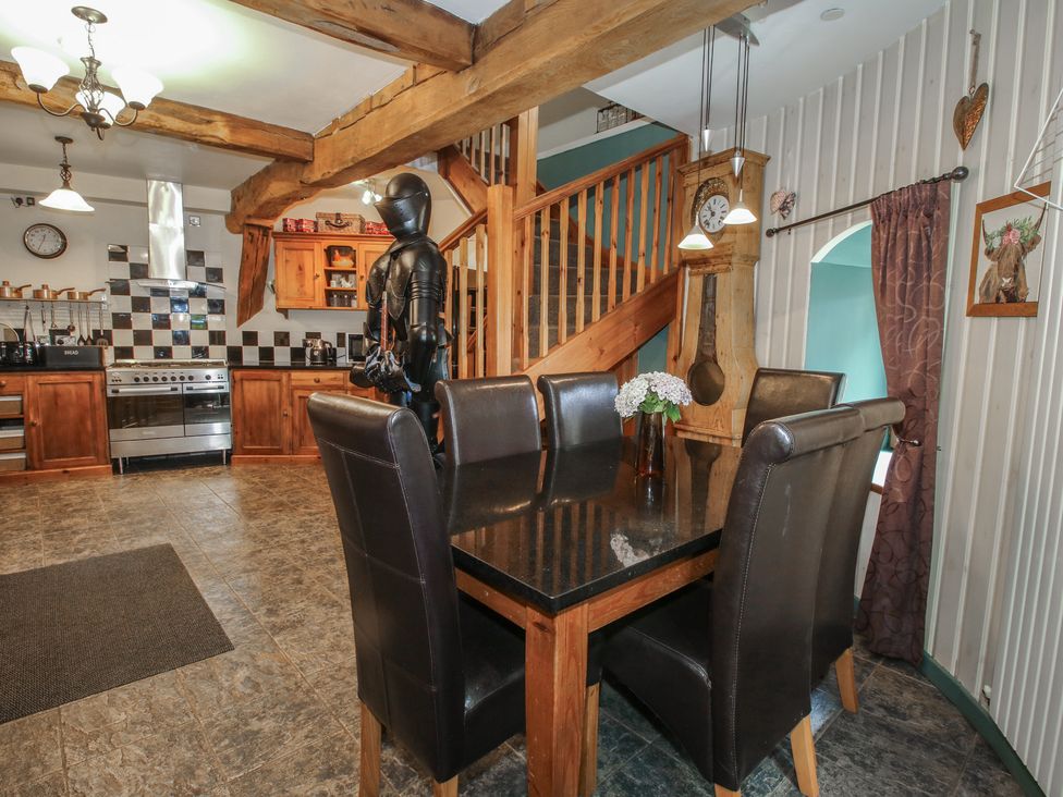A kitchen with a dining table and chairs at Hadley Park Windmill near Telford