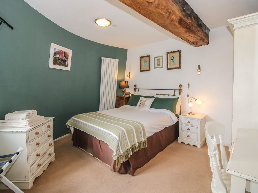 A bedroom with a bed and bedside table at Hadley Park Windmill near Telford