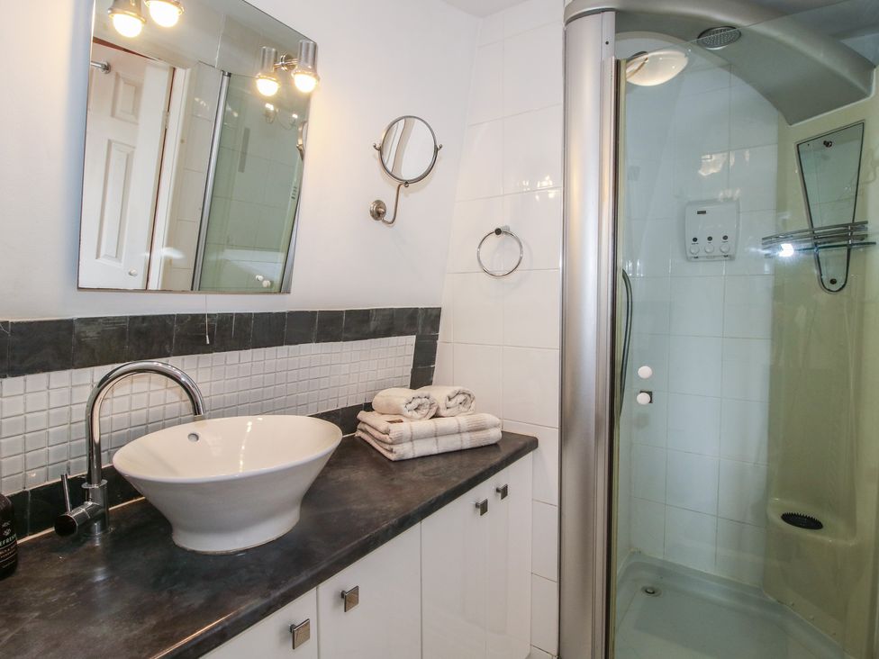A bathroom with a sink and shower at Hadley Park Windmill near Telford