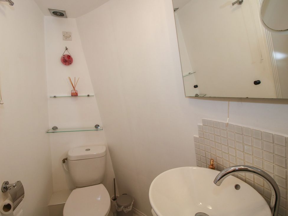 A bathroom with a toilet and sink at Hadley Park Windmill near Telford