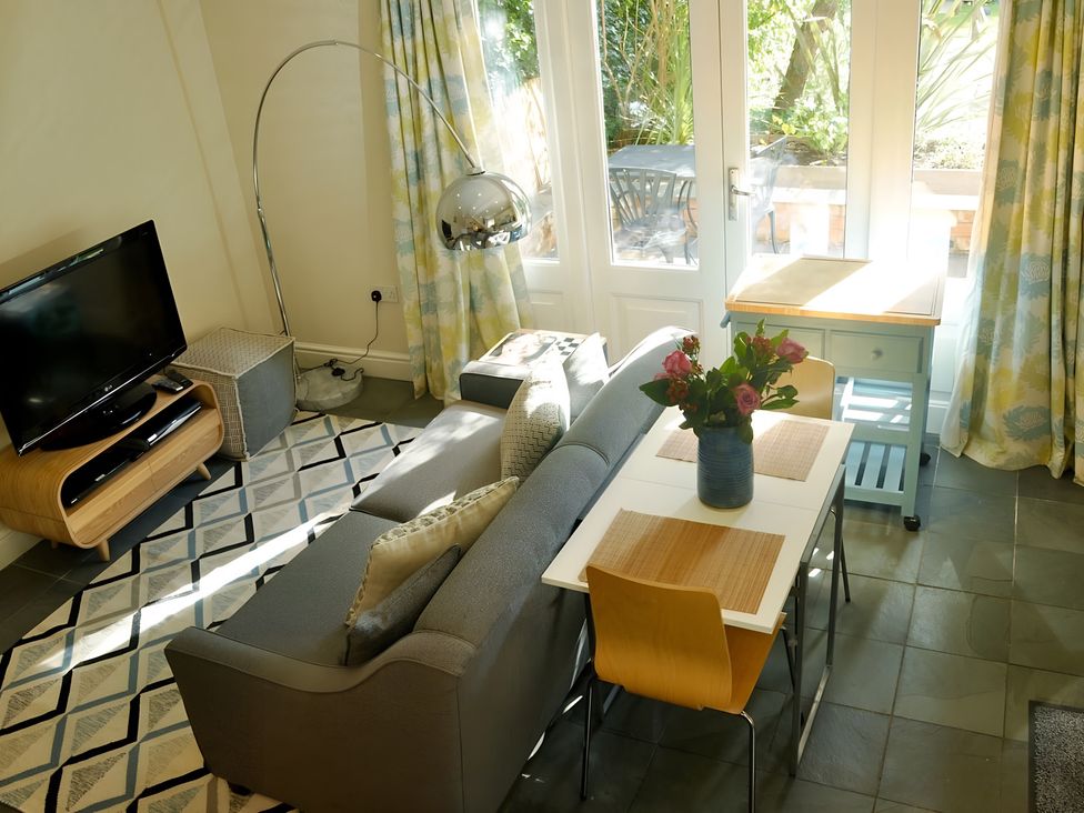A living room with a sofa and television at 45 School Road Birmingham
