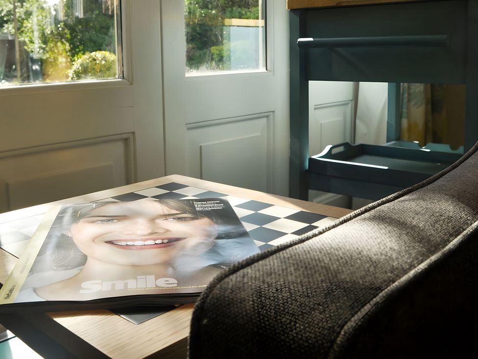 A table with a magazine and a chair at 45 School Road Birmingham