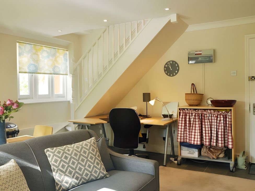 A living room with a desk and chair at 45 School Road, Birmingham