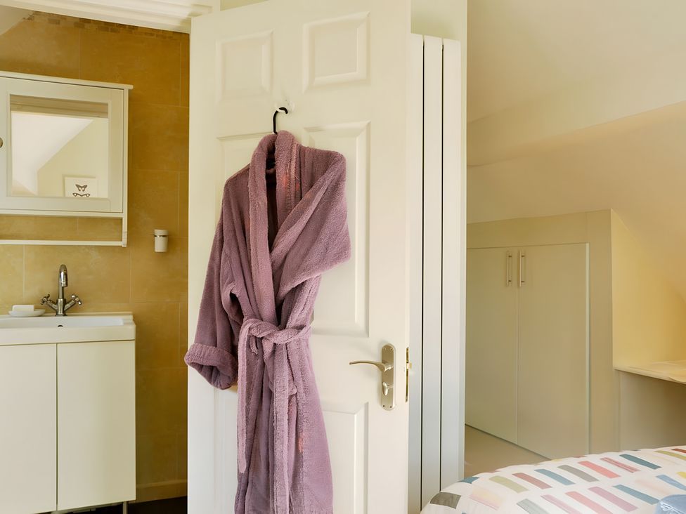 A bathroom with a sink and mirror at 45 School Road Birmingham