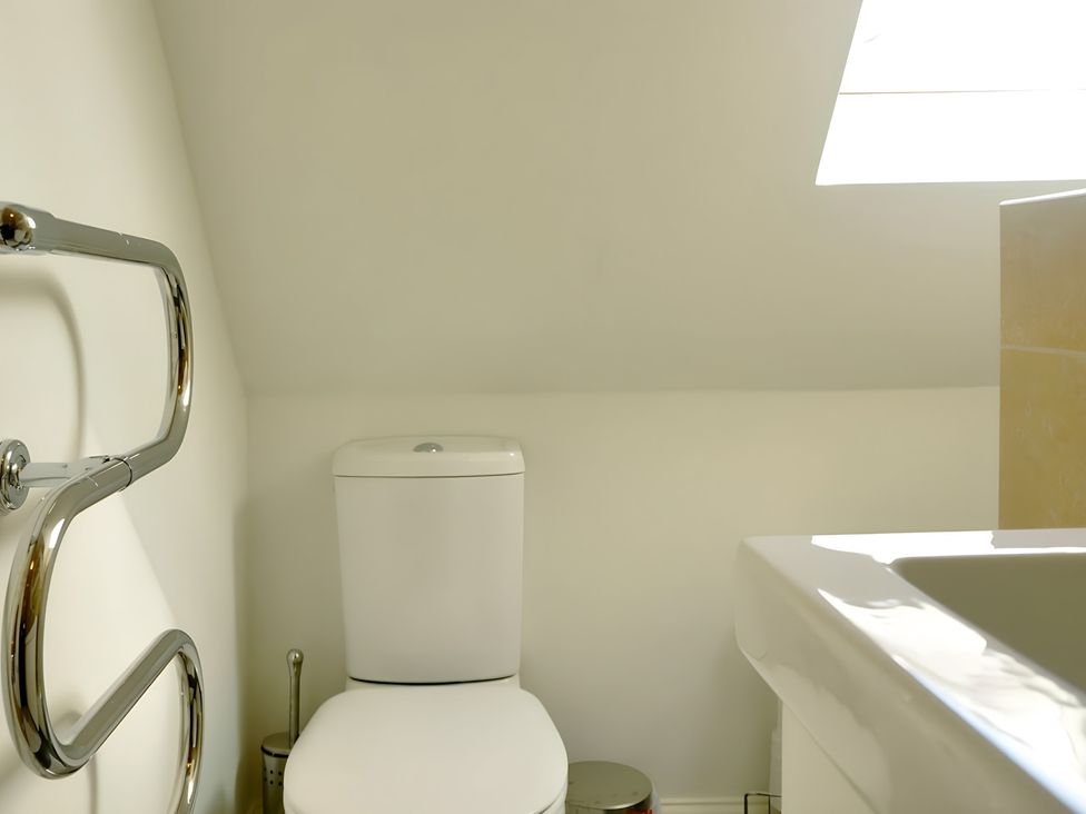 A bathroom with a toilet and sink at 45 School Road Birmingham