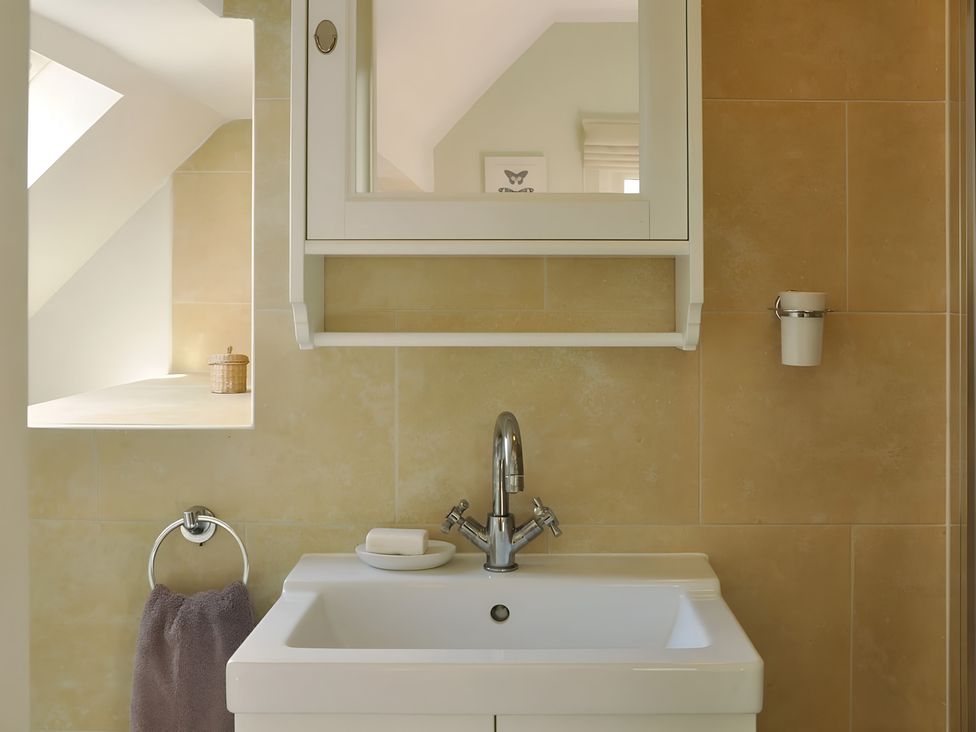 A bathroom with a sink and mirror at 45 School Road Birmingham