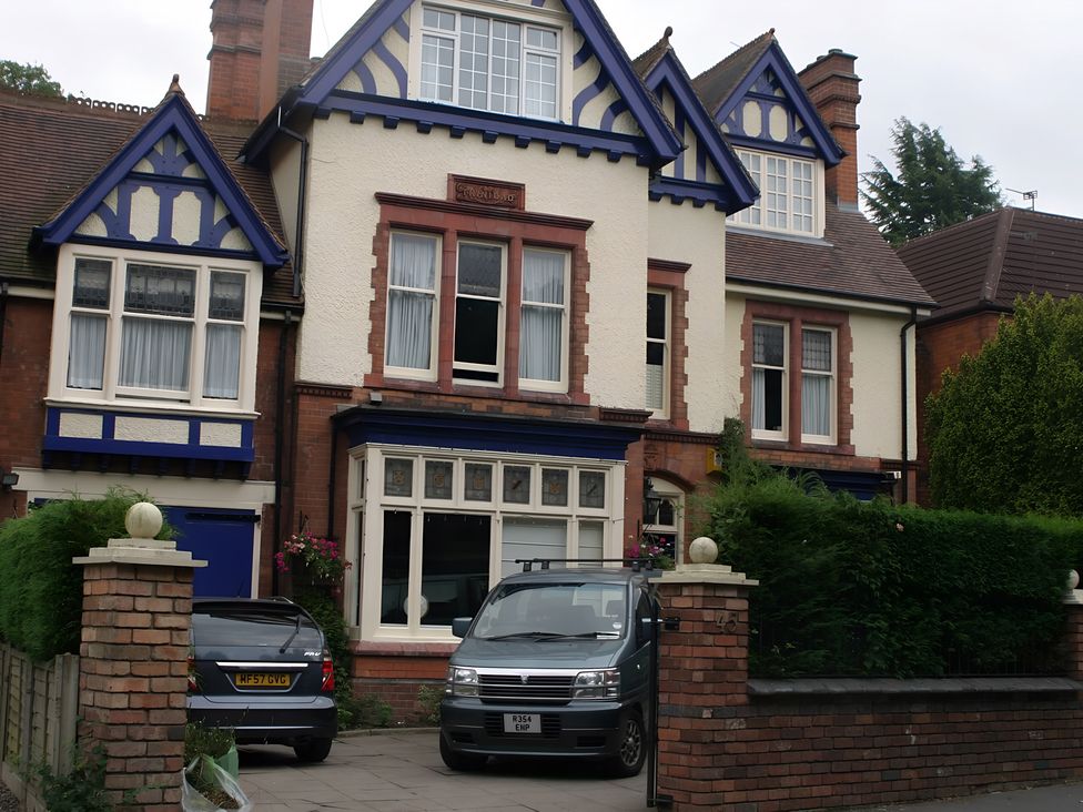 A house with two vehicles parked in front at 45 School Road Birmingham