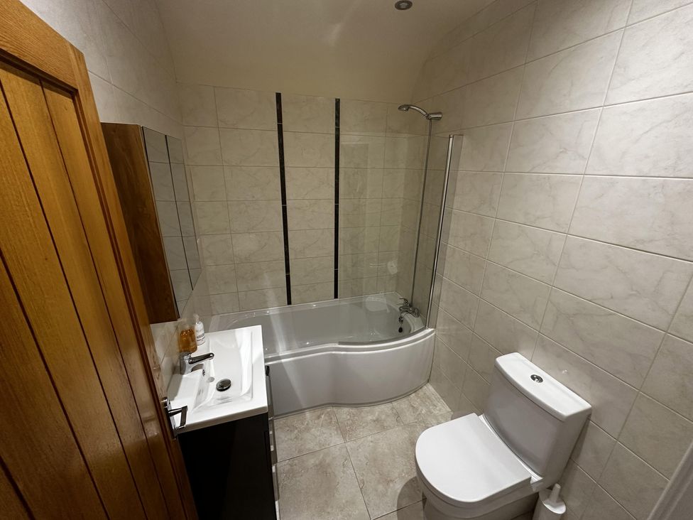A bathroom featuring a bathtub, toilet, and sink at The Rocks in Newry
