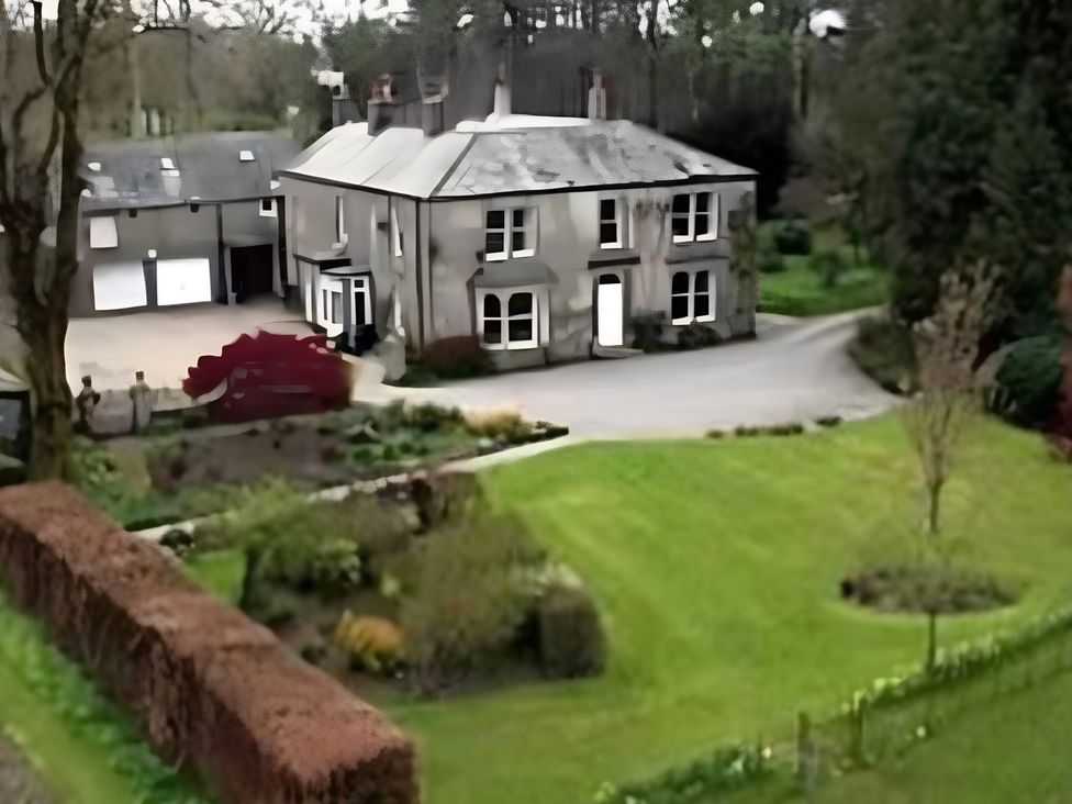 A house with a garage and garden at Studio Apartment at High Dyke Farm in Cockermouth