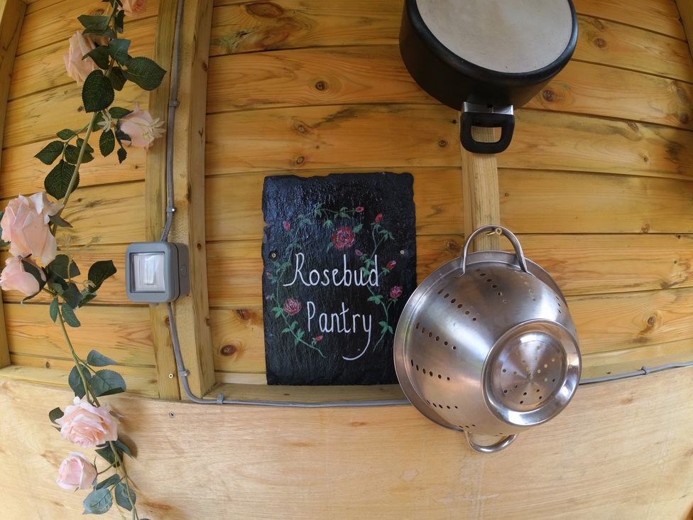 A pantry with a sign and kitchen utensils at Rosebud Meadow Pod 2 Malvern
