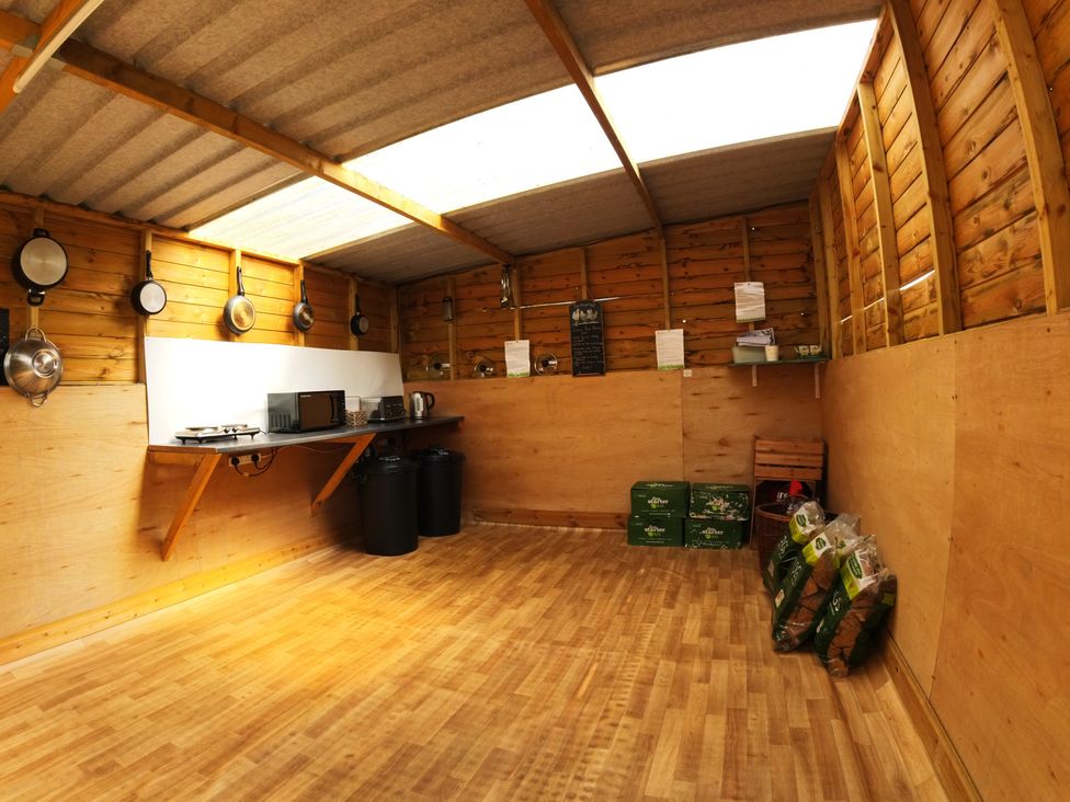 A kitchen with equipment and storage at Rosebud Meadow Pod 4 Malvern