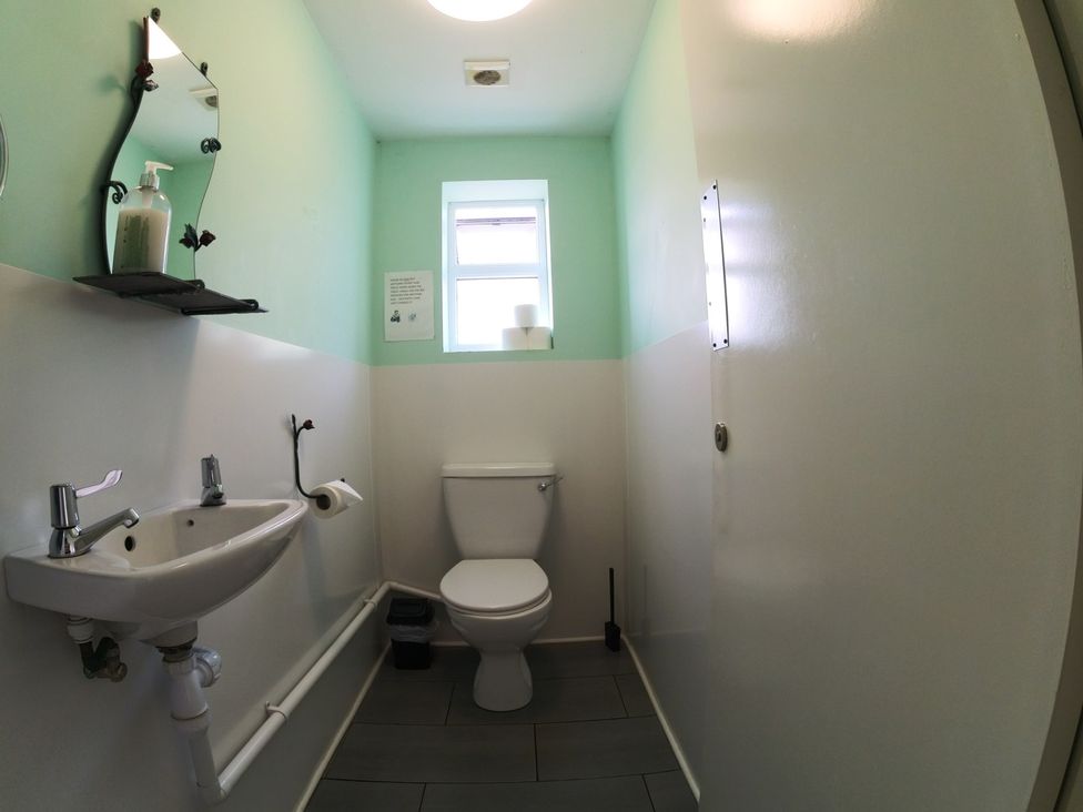 A bathroom with a sink and toilet at Rosebud Meadow Pod 4 in Malvern