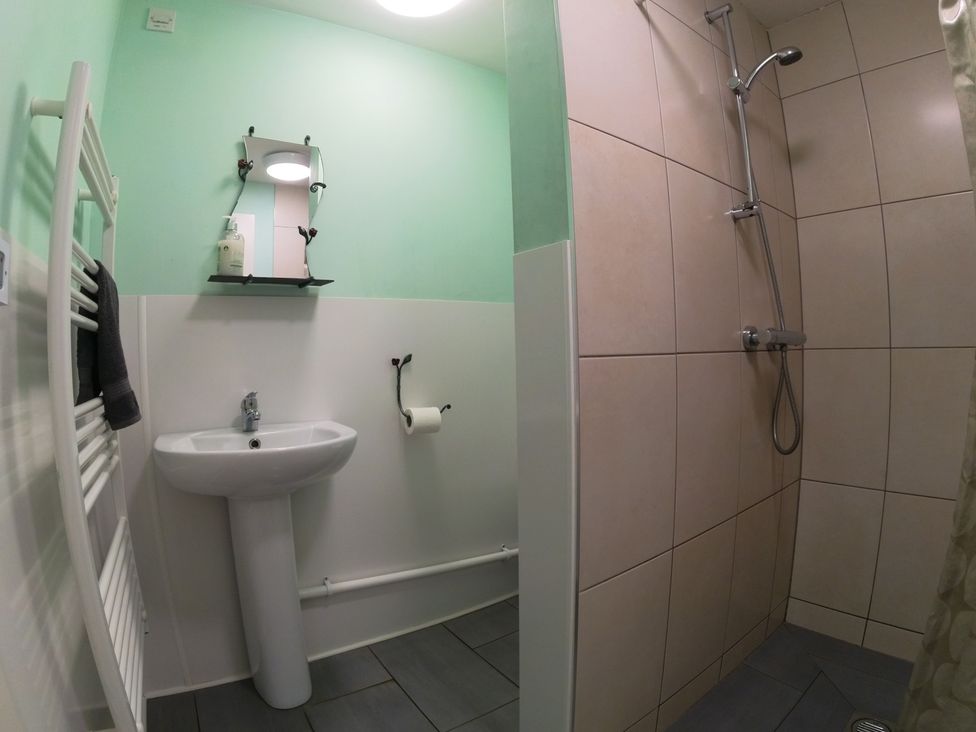 A bathroom with sink and shower at Rosebud Meadow Pod 4 in Malvern