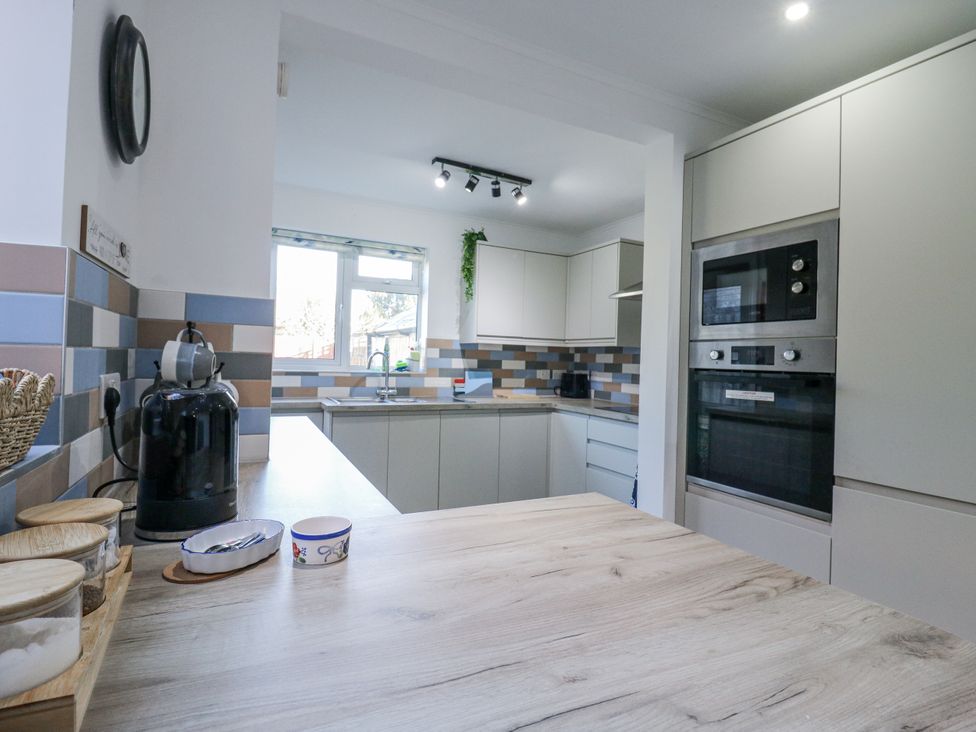 A kitchen with a countertop and appliances at Beachside Terrace in Harwich