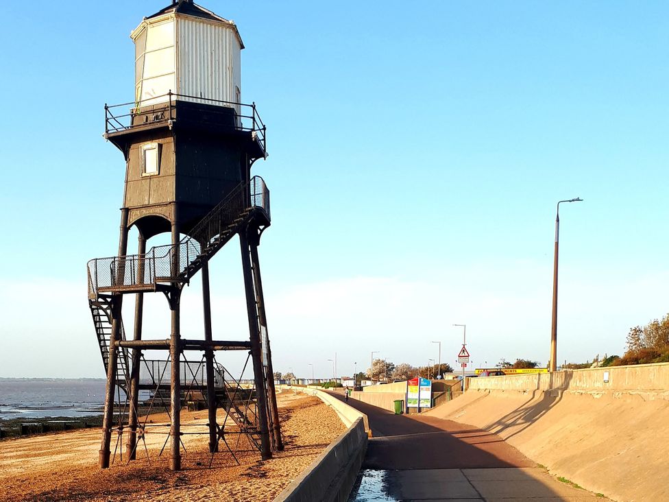 A lighthouse beside a pathway at Beachside Terrace in Harwich