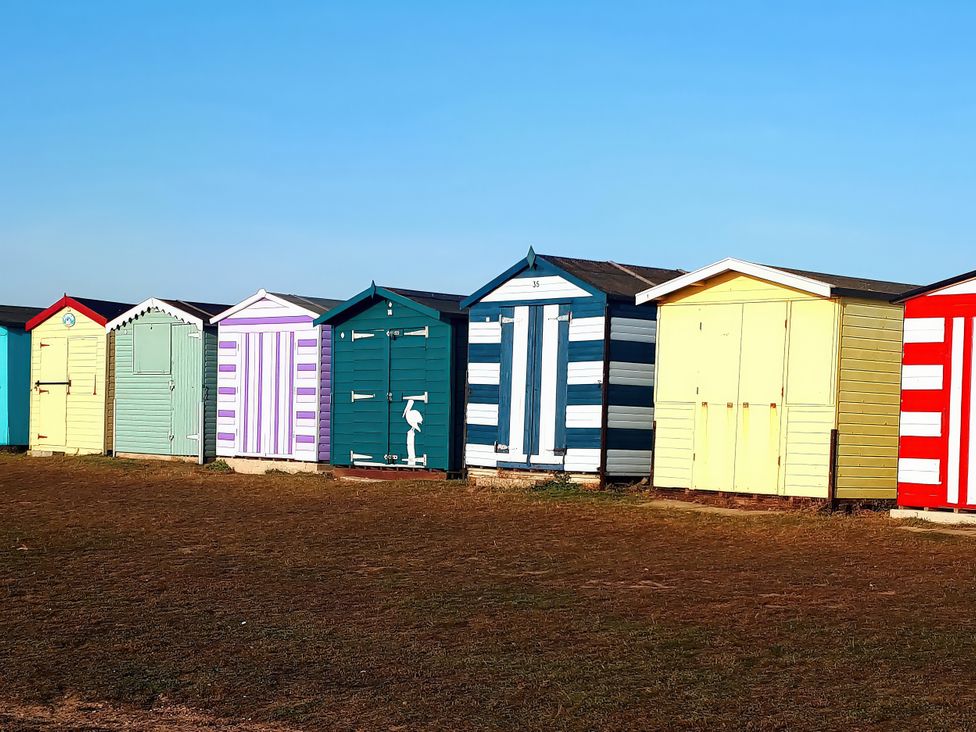Beach huts in a row at Beachside Terrace, Harwich