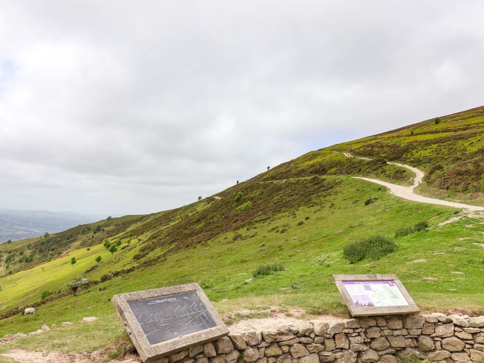 A hillside with a path and signboards at Upstairs at the Sun Inn Mold