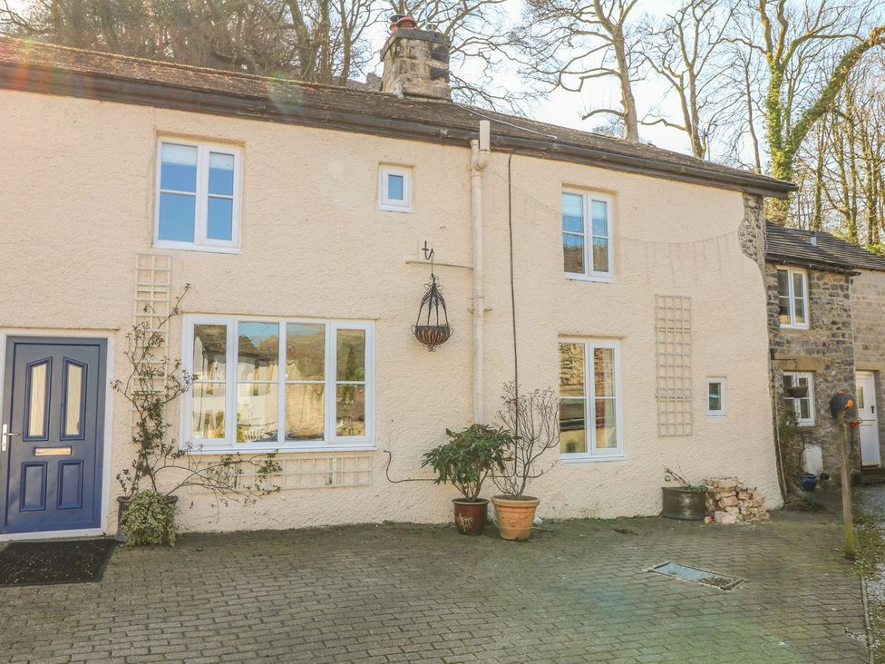 An exterior view of a house with a door and multiple windows at Little Bargate in Castleton, Peak District