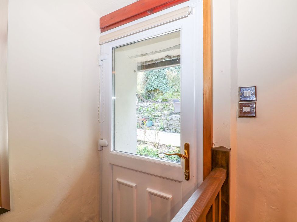 An entryway with a door leading outside at Little Bargate in Castleton, Peak District