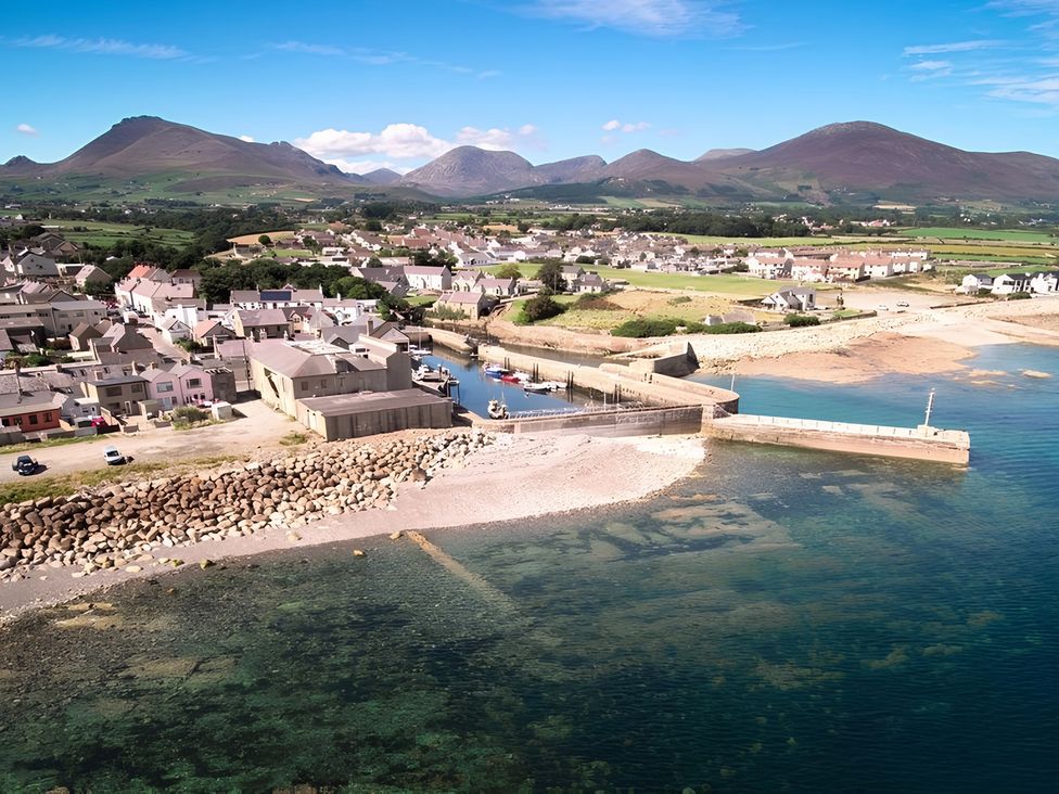 A coastal view with houses and boats at 87 Ballyveaghmore Road in Newry