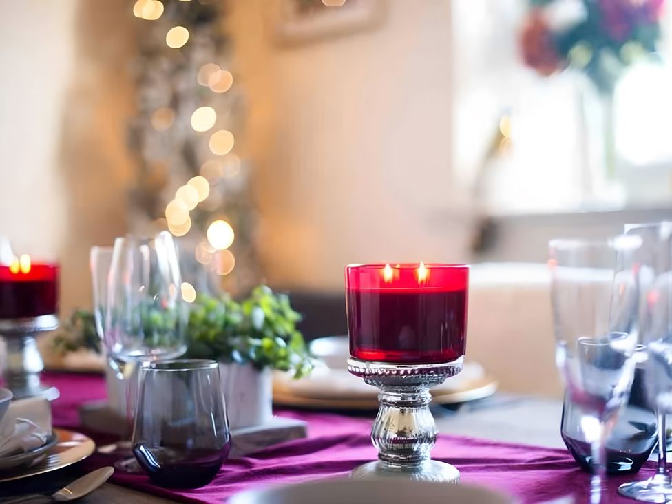 A dining table with candle and glasses at 29 Chapel Street Appleby-In-Westmorland