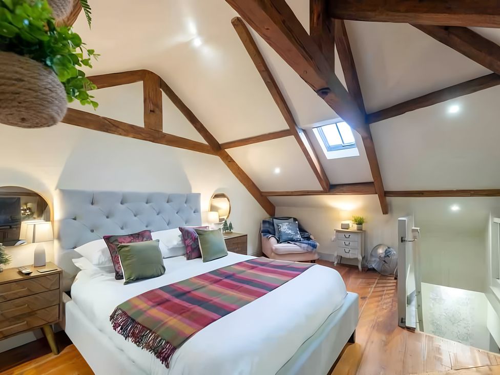 A bedroom with a bed and nightstand at 29 Chapel Street Appleby-In-Westmorland