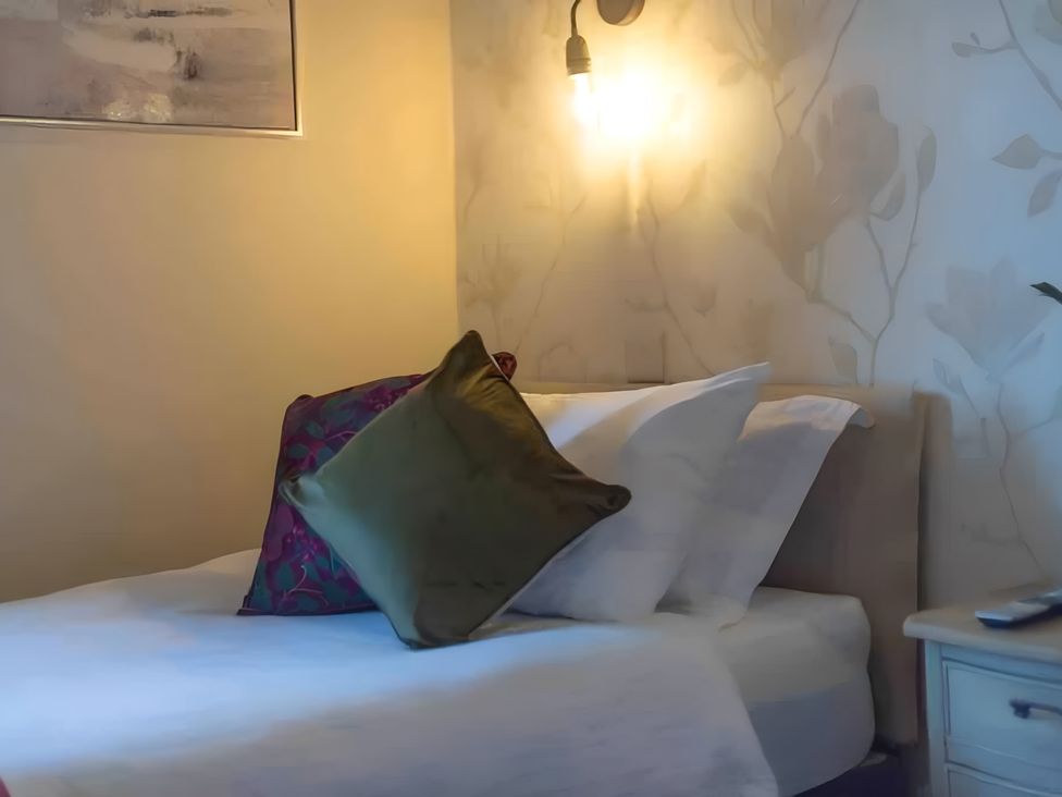 A bedroom with a bed and pillows at 29 Chapel Street Appleby-In-Westmorland