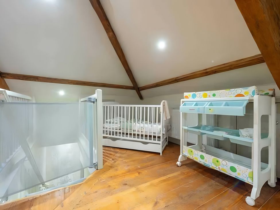 A nursery with two cribs and a changing table at 29 Chapel Street Appleby-In-Westmorland
