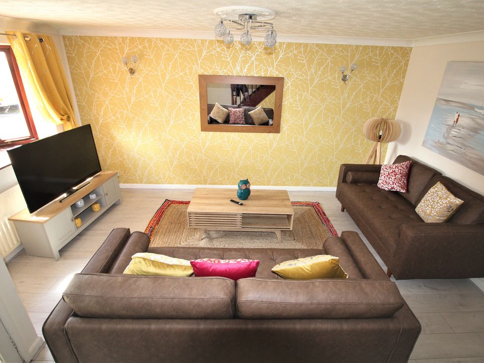A living room with a sofa and a coffee table at 41 St. Georges Road Doncaster