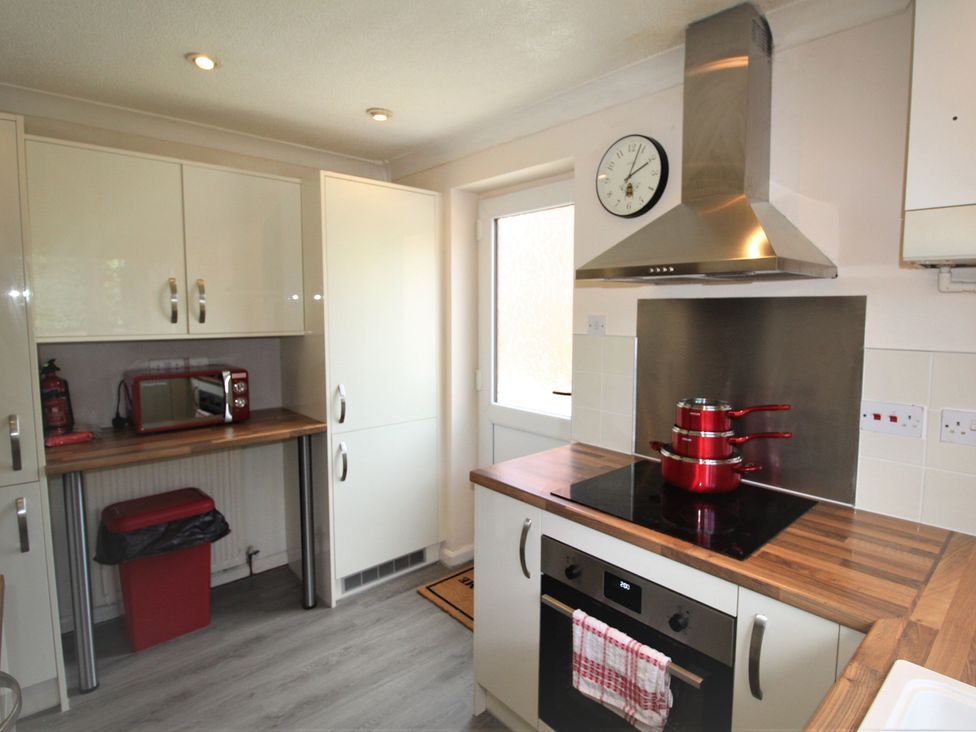 A kitchen with cabinets and appliances at 41 St. Georges Road Doncaster