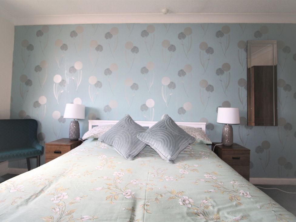 A bedroom with a bed and bedside tables at 41 St. Georges Road in Doncaster
