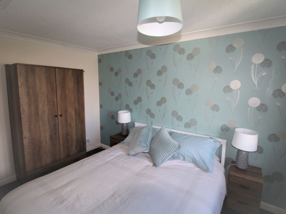 A bedroom with a bed and wardrobe at 41 St. Georges Road Doncaster