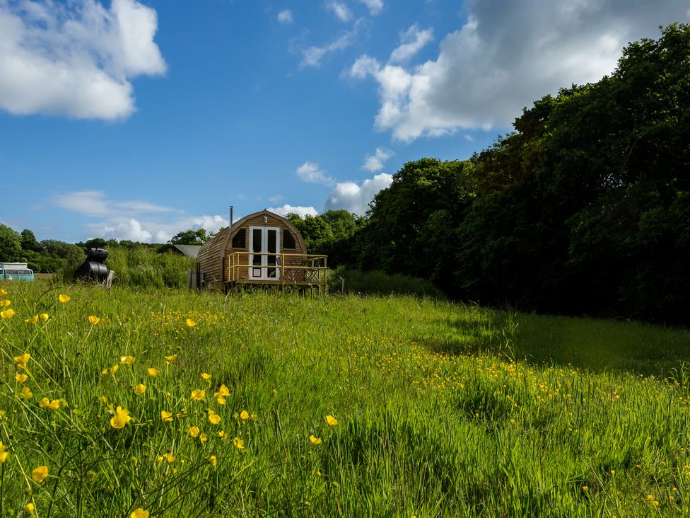 A glamping pod in a field with wildflowers at Glamping pod-Luxury Glamping Retreat in Battle