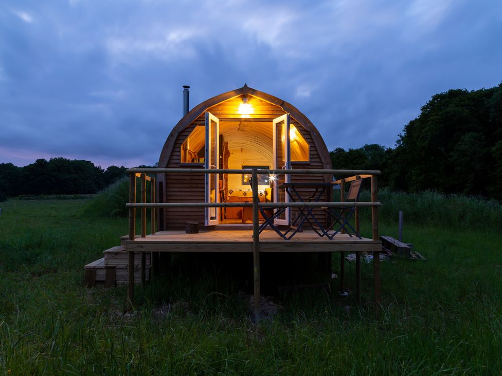A glamping pod with lights on a deck at Glamping pod-Luxury Glamping Retreat in Battle