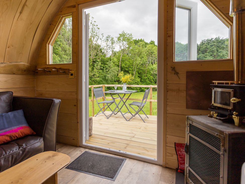 A living room with a view of a deck at Glamping pod-Luxury Glamping Retreat in Battle