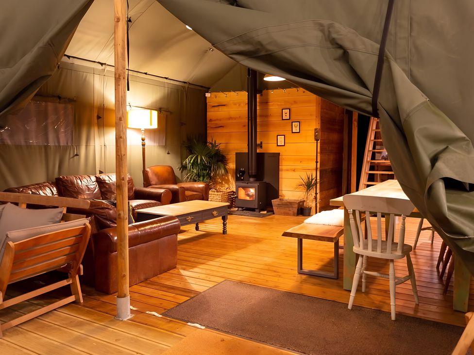 A living room with a sofa and coffee table at Badger - Luxury Glamping Retreat, Battle