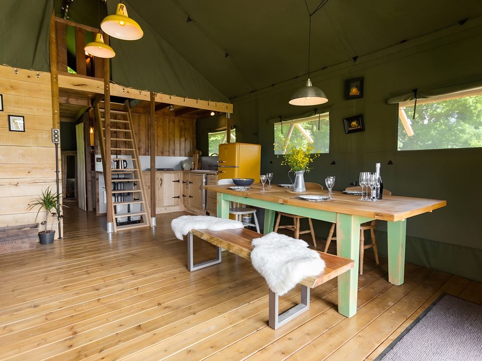 A dining room with a table and chairs at Badger - Luxury Glamping Retreat in Battle