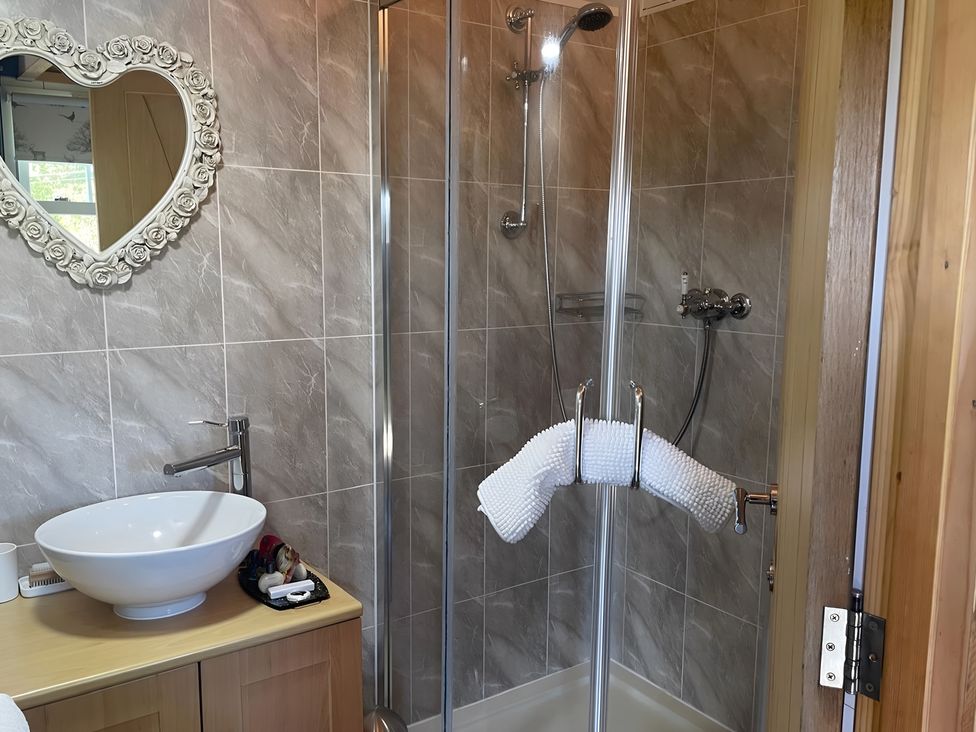 A bathroom with a shower and sink at Tylands in Camelford