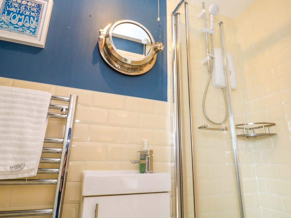 A bathroom with a shower and sink at Cubs Corner in St Agnes