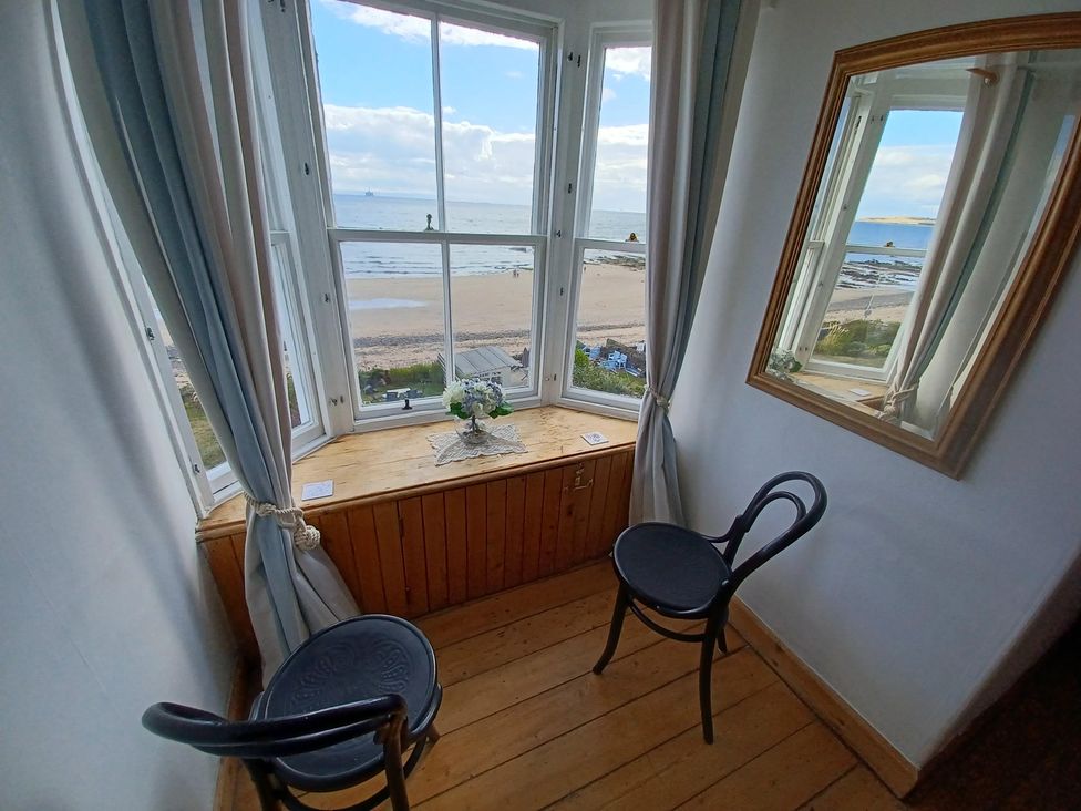 A seating area with a view at Beach Haven 116 in Leven