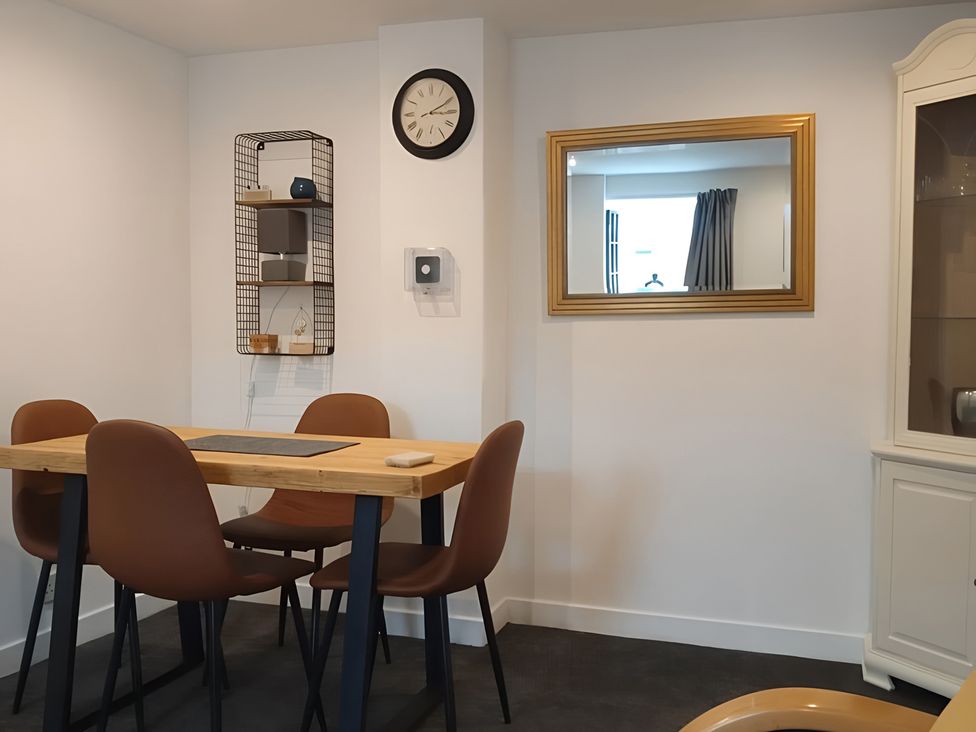 A dining room with a table and chairs at 14 Largo Road Leven