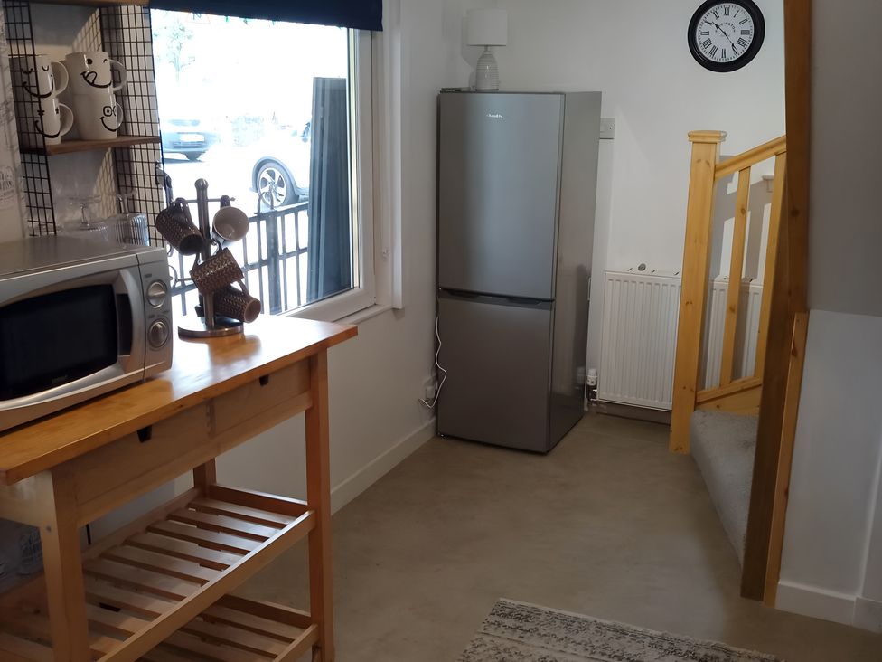 A kitchen with microwave and fridge at 14 Largo Road, Leven