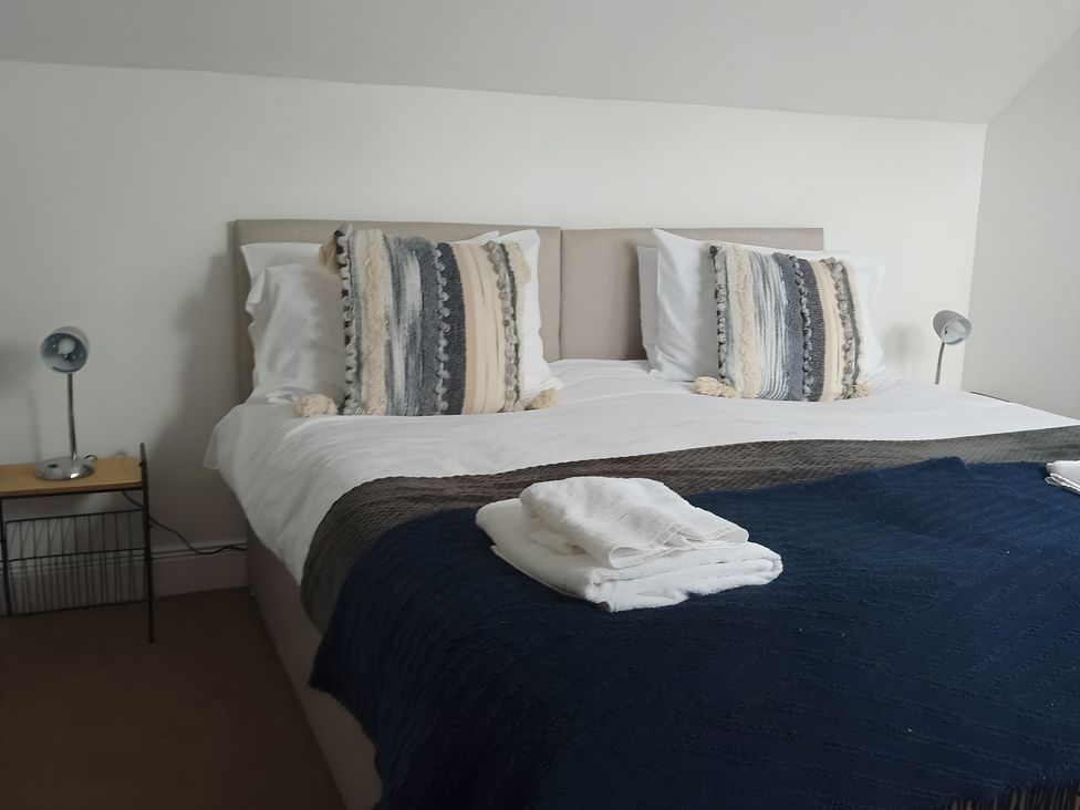 A bedroom with a bed and bedside table at 14 Largo Road in Leven