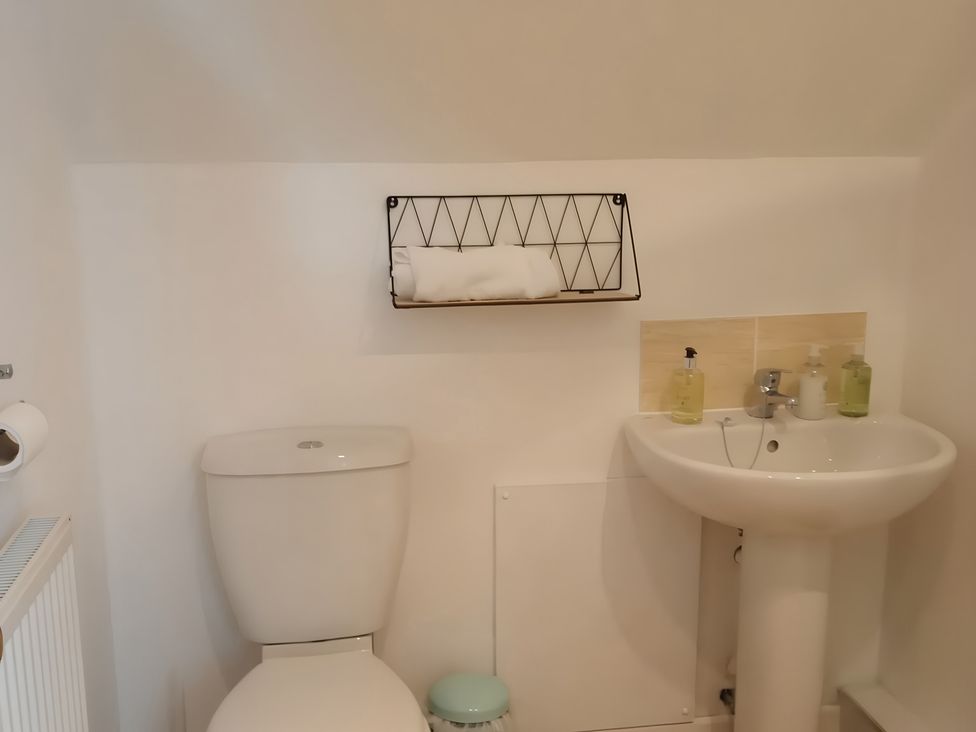 A bathroom with a toilet and sink at 14 Largo Road in Leven