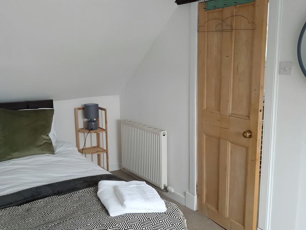 A bedroom with a bed and bedside table at 14 Largo Road Leven