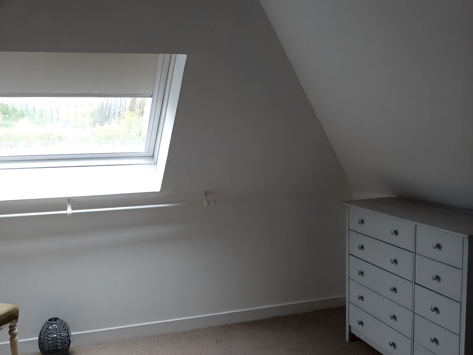 A bedroom with a window and dresser at 14 Largo Road Leven