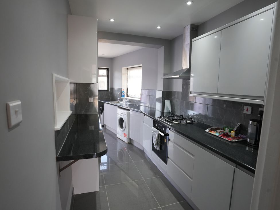 A kitchen with counter space and appliances at Westwick Gardens Retreat in Hounslow