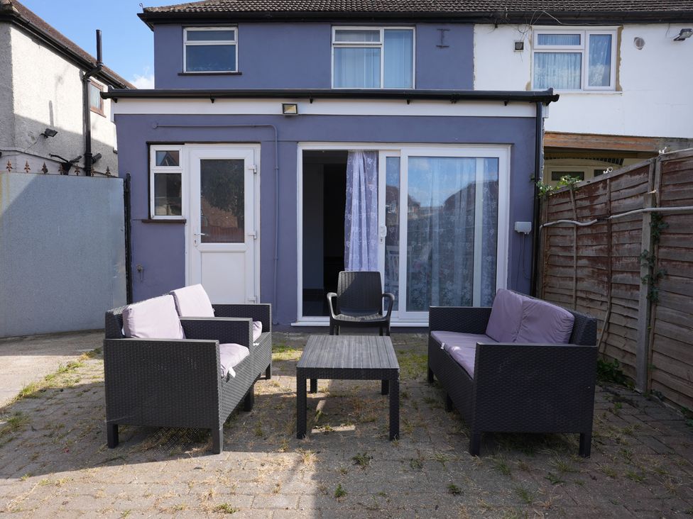 Outdoor seating area with furniture at Westwick Gardens Retreat in Hounslow