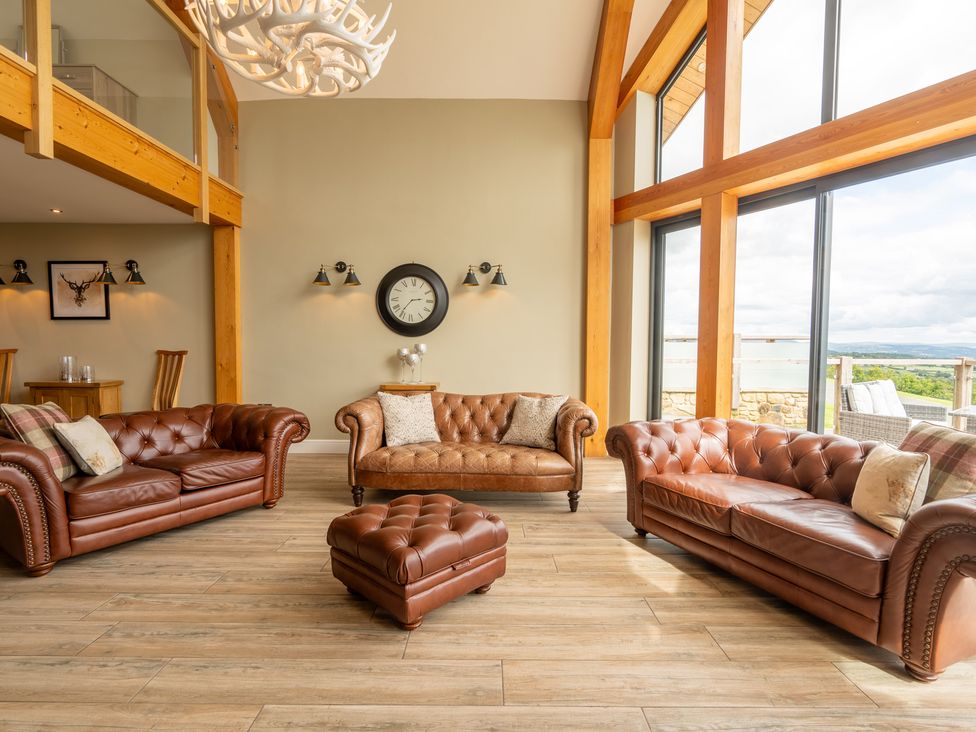 A living room with three sofas and a coffee table at Valley View Lodge 1 Preston