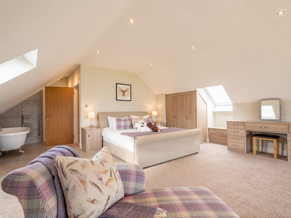 A bedroom with a bed and bathtub at Valley View Lodge 1 Preston